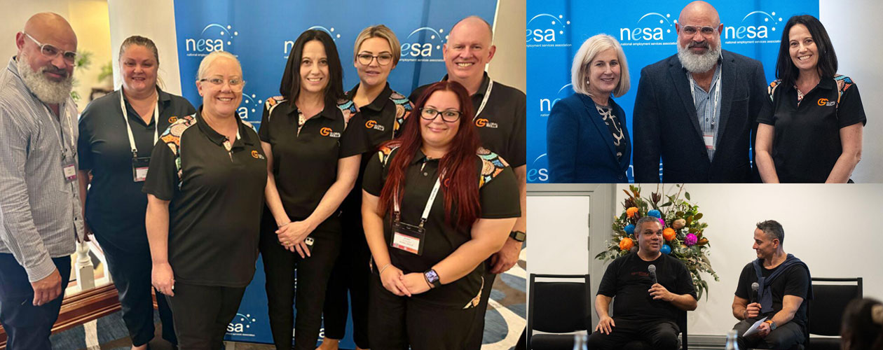 Global skills staff standing in front of NESA banner at the conference