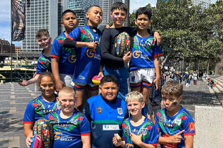 Jets U10s team outside the stadium where 2024 grand final was played