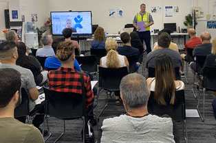 An employer presents opportunities to attendees on the day